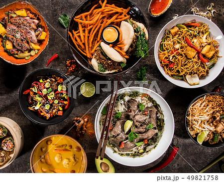 Asian food background with various ingredients on rustic stone background , top view. Asian food background with various ingredients on rustic stone background , top view. 49821758