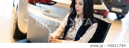 Portrait of beautiful sales manager working on the laptop Portrait of beautiful sales manager working on the laptop 49821784