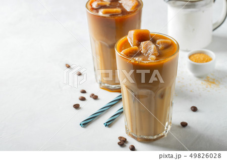 Two glasses of cold coffee on white background. Two glasses of cold coffee on white background. 49826028