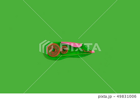 tape corrector on a green background 49831006