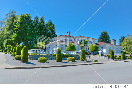 Luxury residential house fenced with white balustrade on the top of terrace 49832444