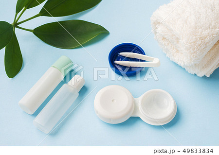 Contact lenses, tweezers and a container Contact lenses, tweezers and a container 49833834