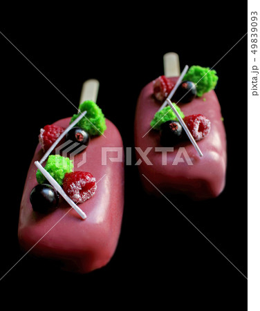 Pink glazed berry gelato ice cream on stick with 49839093