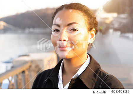A beautiful young girl of African ethnicity with A beautiful young girl of African ethnicity with 49840385
