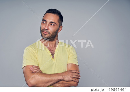 Closeup of casual hispanic man looking at camera Closeup of casual hispanic man looking at camera 49845464
