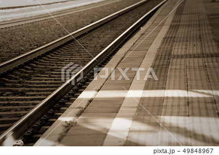 rails concept, on empty train platform. rails concept, on empty train platform. 49848967
