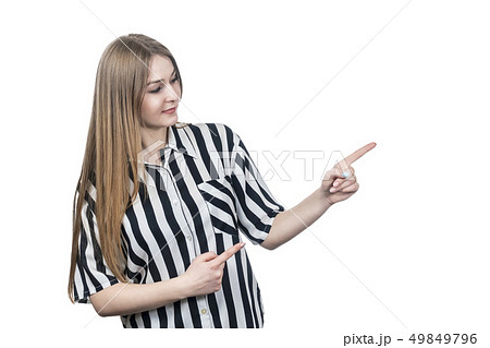 woman in shirt points to the side woman in shirt points to the side 49849796