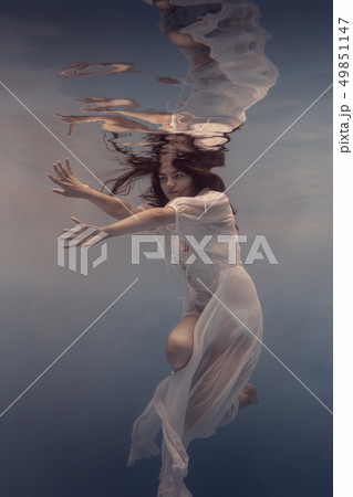 Portrait of a girl in a white dress under water Portrait of a girl in a white dress under water 49851147