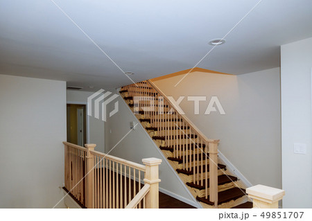 Beautiful stair railing and carpeted steps 49851707