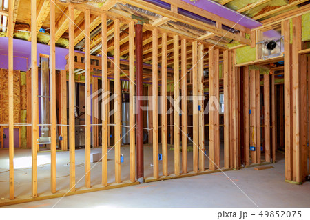 Building the frame of a wooden house Building the frame of a wooden house 49852075