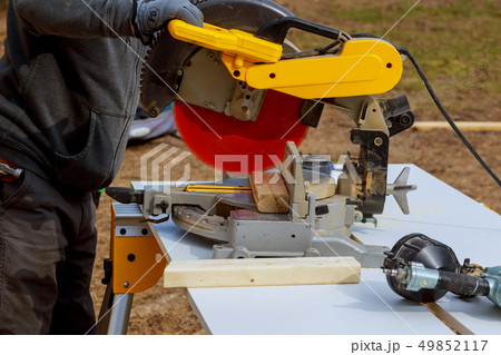 Circular Saw. Carpenter Using Circular Saw 49852117