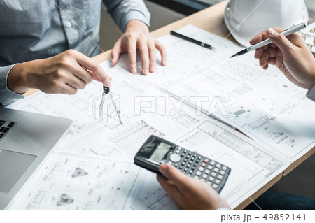 Construction engineering or architect discussing a 49852141