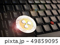 Ripple XRP  coin over a black laptop keyboard 49859095