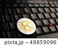 Ripple XRP  coin over a black laptop keyboard 49859096