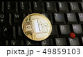 Golden Litecoin LTC  coin over  a black laptop  49859103