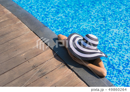 Portrait beautiful young asian woman happy smile relax around swimming pool in hotel resort Portrait beautiful young asian woman happy smile relax around swimming pool in hotel resort 49860264