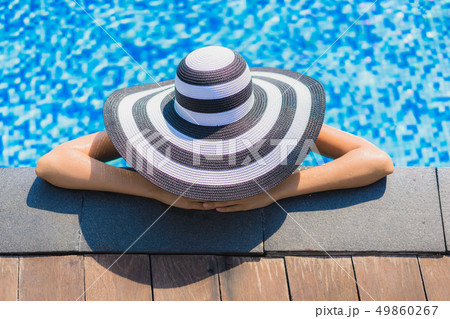 Beautiful young asian woman happy smile and relax in swimming pool Beautiful young asian woman happy smile and relax in swimming pool 49860267