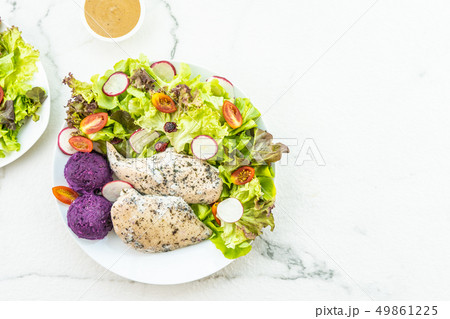 Grilled chicken breast meat steak with fresh vegetable Grilled chicken breast meat steak with fresh vegetable 49861225