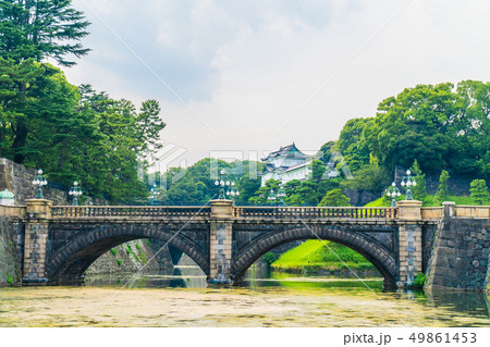 Beautiful old architecture imperial palace castle with moat and bridge at Tokyo city 49861453