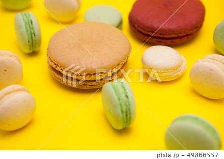 French delicious macaroons dessert over yellow background 49866557