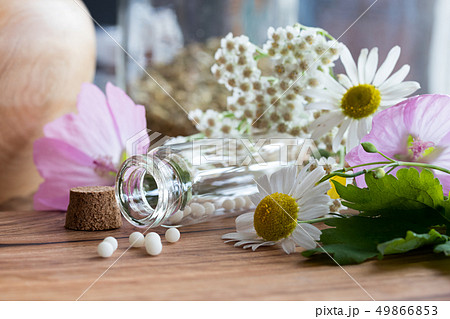 A bottle of homeopathic remedies with chamomile 49866853