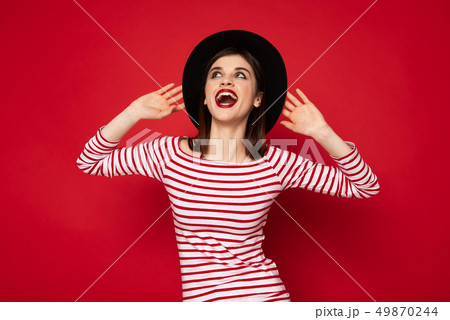 Excited happy lady in striped blouse and boater 49870244