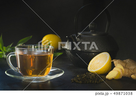 Cup of tea, ginger on dark. Chinese tea concept. Cup of tea, ginger on dark. Chinese tea concept. 49871038