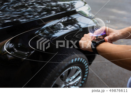 Man using smart watch check tire pressure  Man using smart watch check tire pressure  49876611