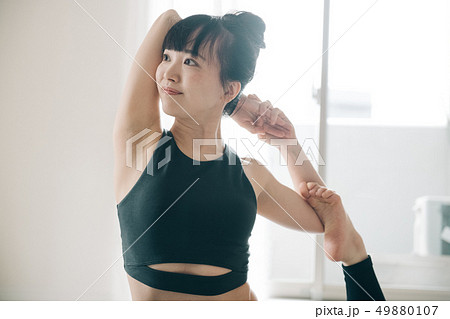 Young woman doing yoga Japanese hot yoga - Stock Photo [49880107 