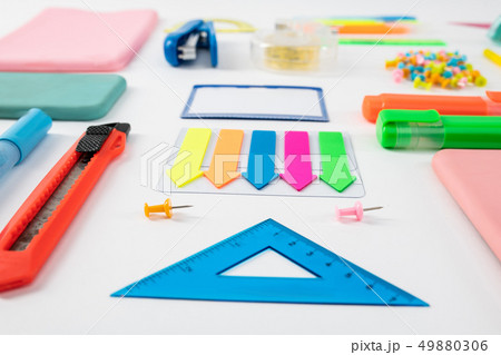 Blue ruler standing with colorful bookmarks with paper knife 49880306