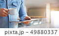 Male hands holding white digital tablet 49880337