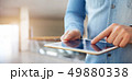 Male hand touching a digital tablet 49880338