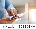A man using tablet in a business center 49880340