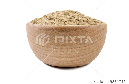 cardamon powder in wooden bowl isolated on white 49881755