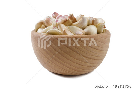 garlic cloves in wooden bowl isolated on white 49881756