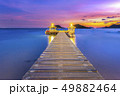 The bridge that stretches out the sea at sunset 49882464