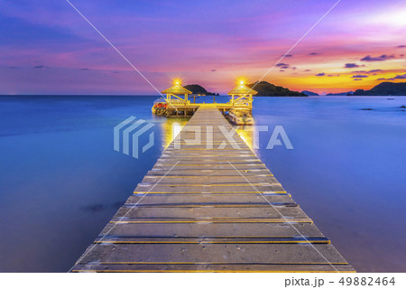 The bridge that stretches out the sea at sunset 49882464