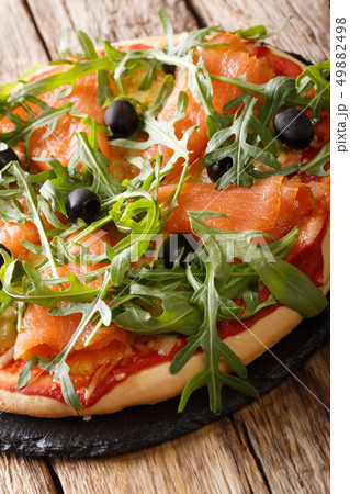 Delicious pizza with salted salmon, arugula, 49882498