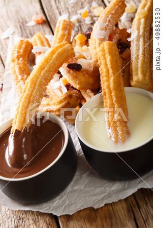 Traditional churros with hot chocolate and Traditional churros with hot chocolate and 49882530