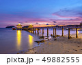 The bridge that stretches out the sea at sunset 49882555