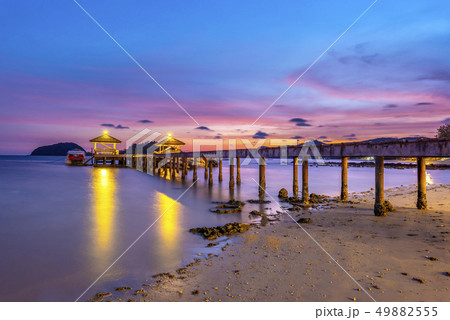 The bridge that stretches out the sea at sunset 49882555
