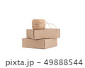 Stack of craft paper boxes and coil of rope isolated on white. 49888544