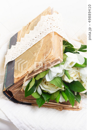 Old books with flowers 49889410