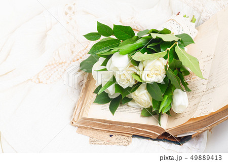 Old books with flowers 49889413