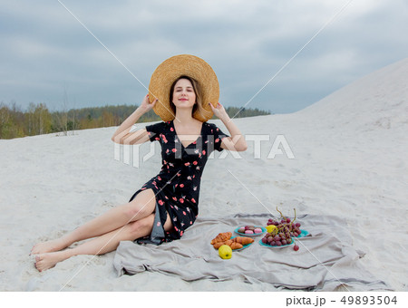 Beautiful woman have a rest on a beach near a sea. Beautiful woman have a rest on a beach near a sea. 49893504
