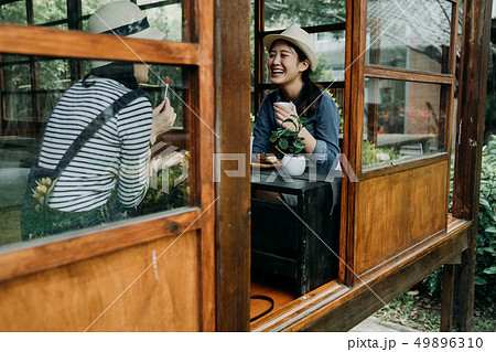 smiling women with tea bowls in chado outdoor 49896310
