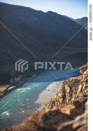 Amazing landscape with mountains, beautiful curving river, autumn forest in Altai. Mountain valley. Amazing landscape with mountains, beautiful curving river, autumn forest in Altai. Mountain valley. 49899106