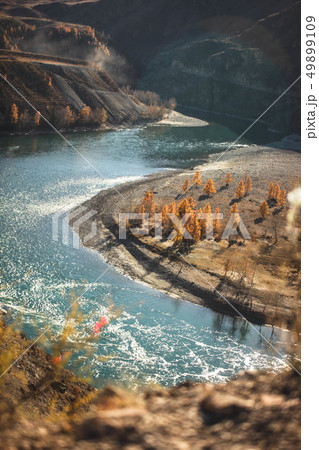 Amazing landscape with mountains, beautiful curving river, autumn forest in Altai. Mountain valley. Amazing landscape with mountains, beautiful curving river, autumn forest in Altai. Mountain valley. 49899109
