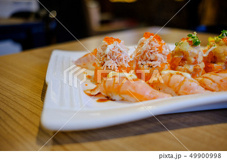 Salmon Sushi is a popular Japanese food. Salmon Sushi is a popular Japanese food. 49900998