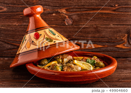 Traditional Moroccan chicken tagine with olives Traditional Moroccan chicken tagine with olives 49904660